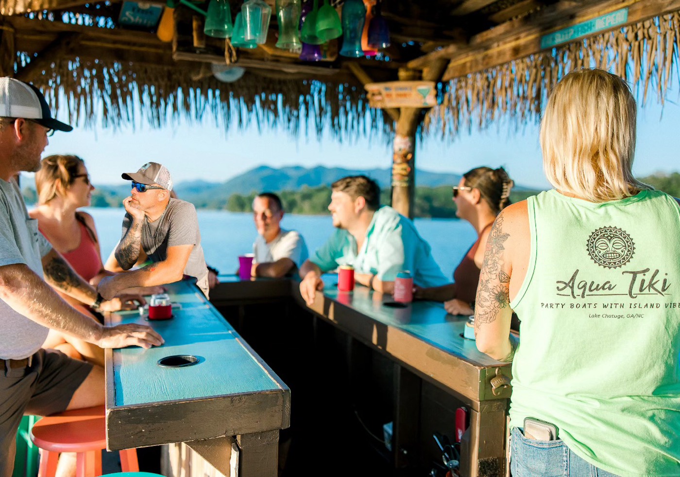 Aqua Tiki crew aboard the tiki boat on Lake Chatuge